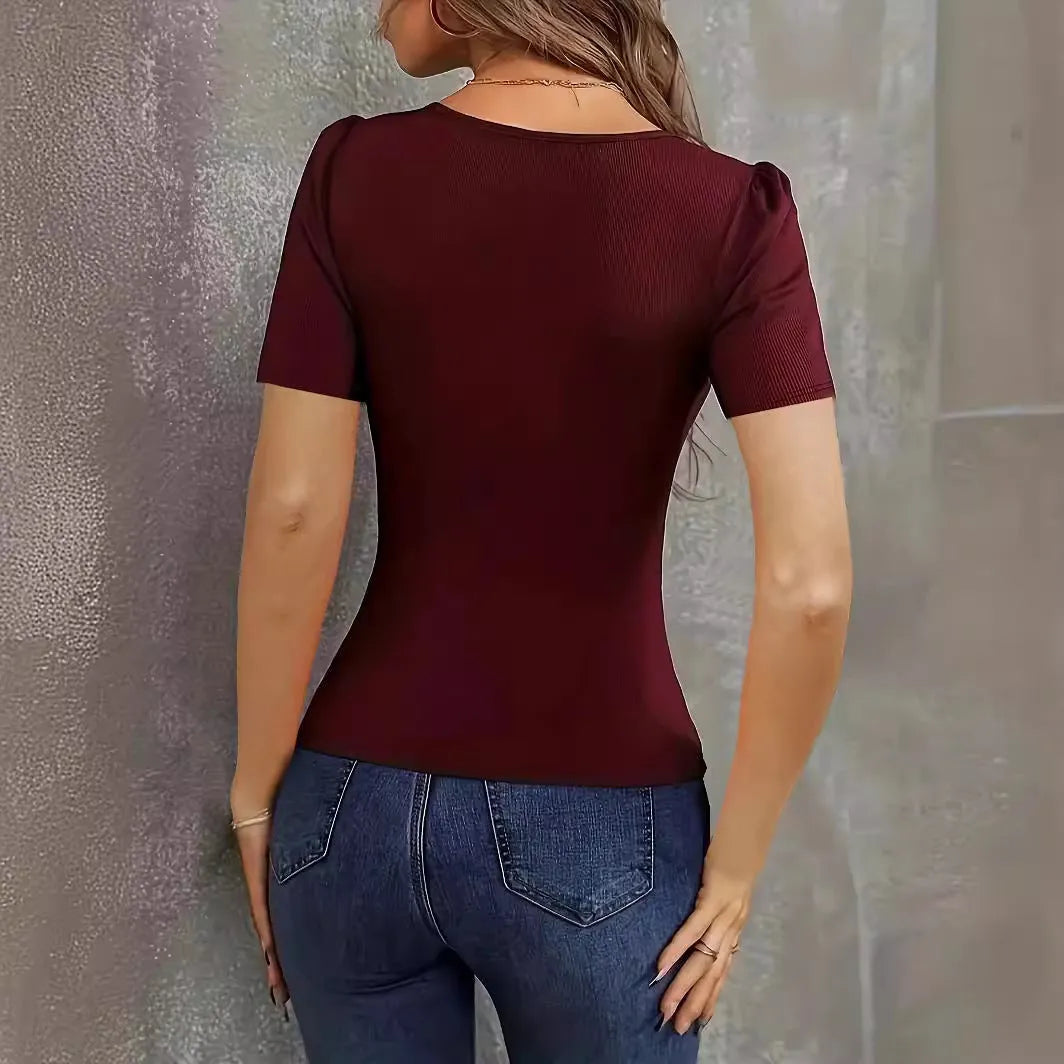 Wine red women's slim fit low neck knitted short sleeve top on a hanger.