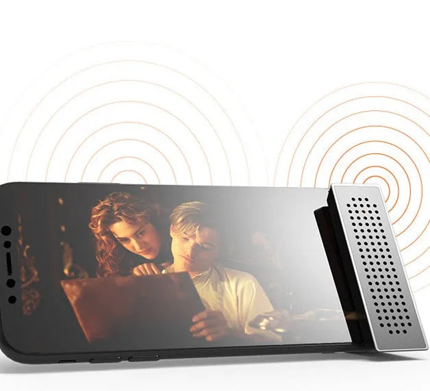 Mini black ABS mobile phone amplifier bracket holding an iPhone on a desktop.