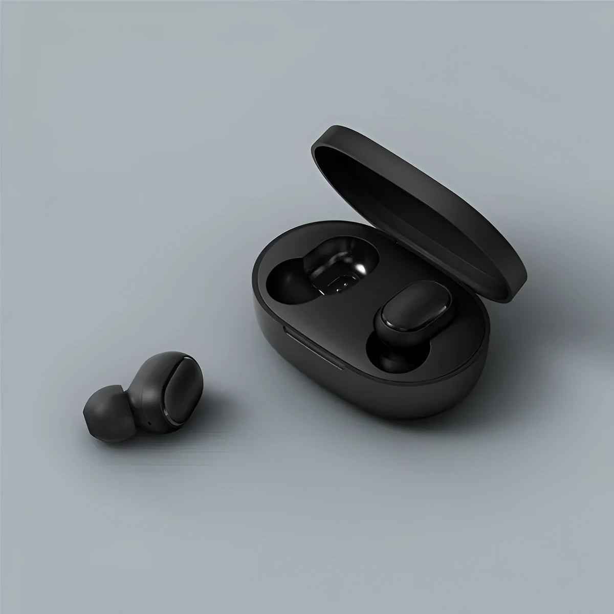 Black Redmi AirDots true wireless earbuds and charging case on a white background.