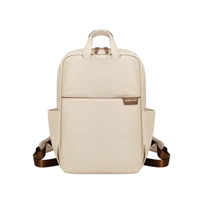 Simple canvas travel women's backpack showing internal laptop compartment and organisation pockets