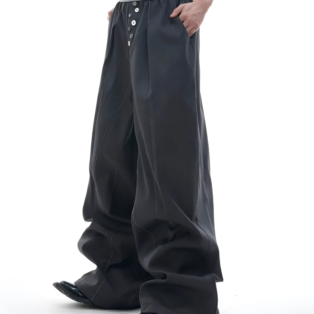 Black straight leg trousers with high waist design and button detail on front
