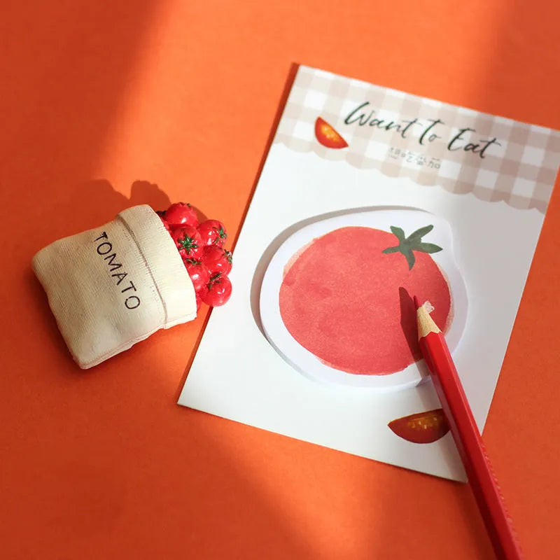 Food themed adhesive note paper pad showing bread, tomato and yoghurt designs, 85mm by 120mm sheet size