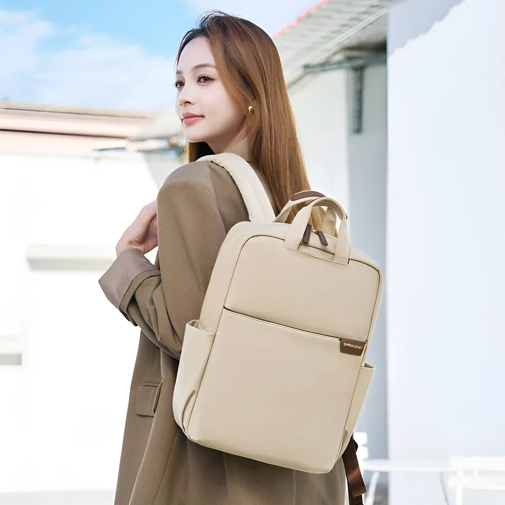 Simple canvas travel women's backpack showing internal laptop compartment and organisation pockets