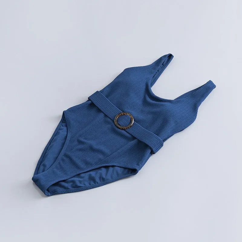 Navy blue one-piece women's swimsuit with triangle slimming shape and chest pads