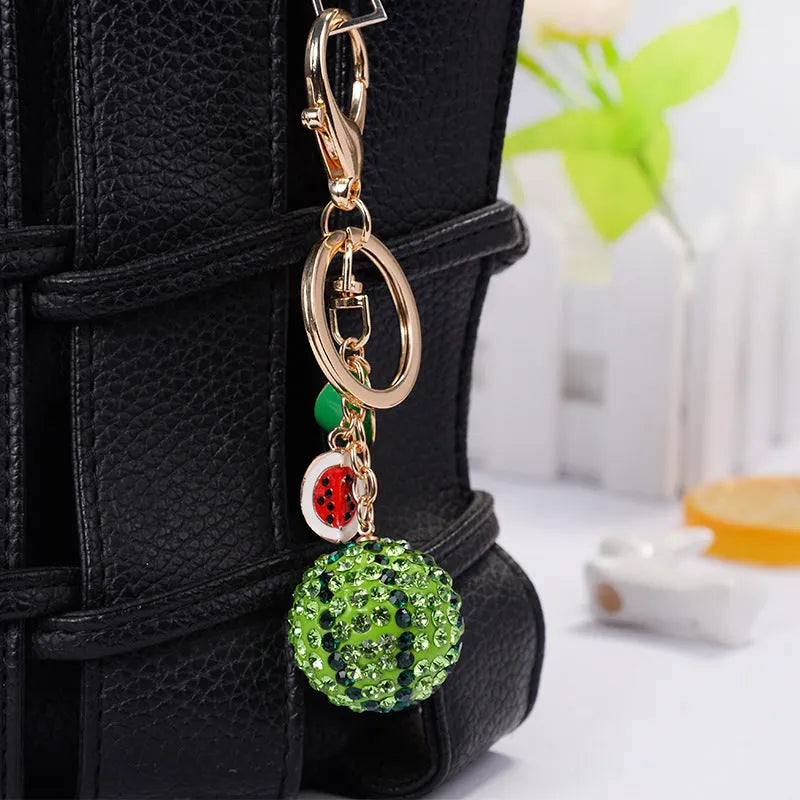 Green zinc alloy watermelon-shaped keychain measuring 12cm with metal keyring