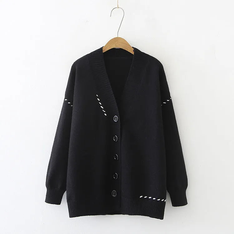 Women's black knitted cardigan top coat with long sleeves and loose fit made from polyester fabric