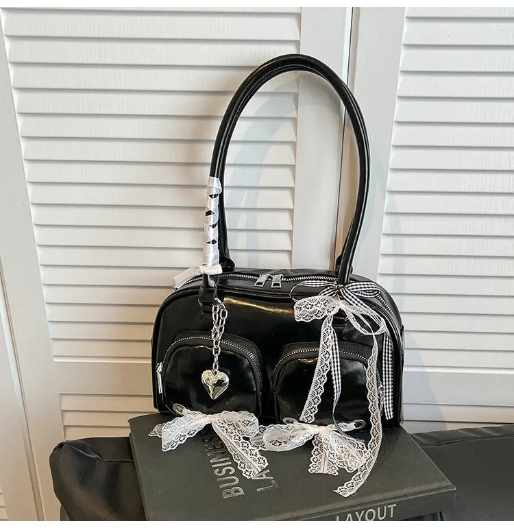Women's soft PU leather shoulder bag in horizontal square shape with phone compartment.