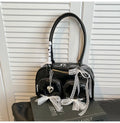 Women's soft PU leather shoulder bag in horizontal square shape with phone compartment.