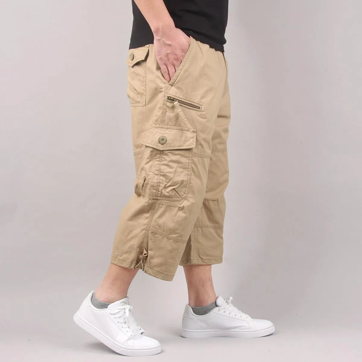 Men's cotton cropped casual pants in khaki colour showing loose fit and short length design