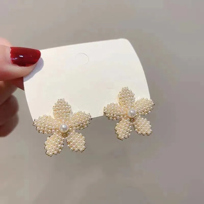 Korean style pineapple and starfish pearl design alloy earrings with electroplated gold, silver, pearl flower, and starfish pearl finishes.