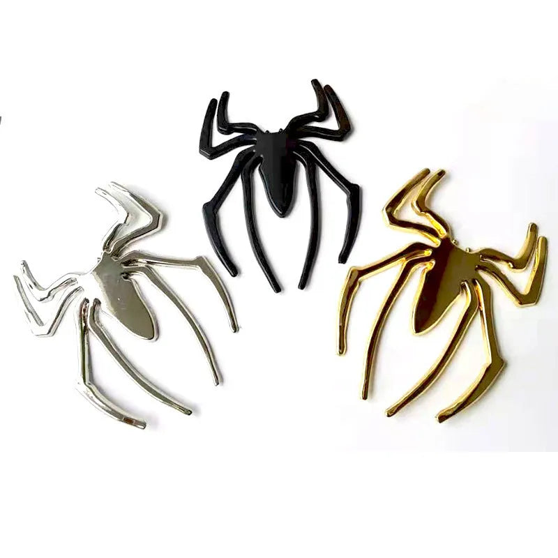 Three-dimensional zinc alloy spider bumper sticker in gold colour measuring 7cm by 5cm