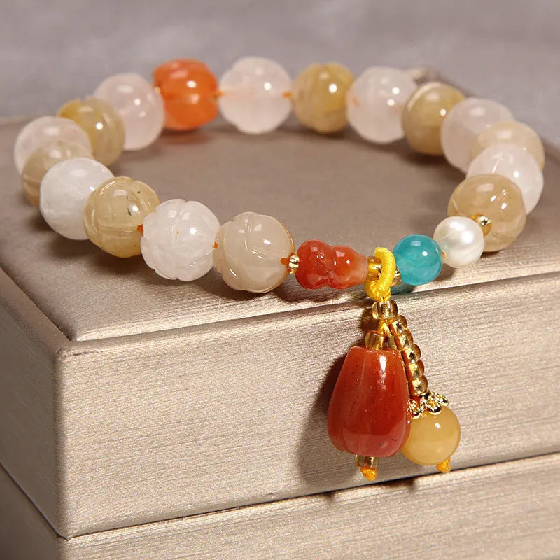 Women's yellow agate crystal bracelet on a gold silk cord, khaki colour.