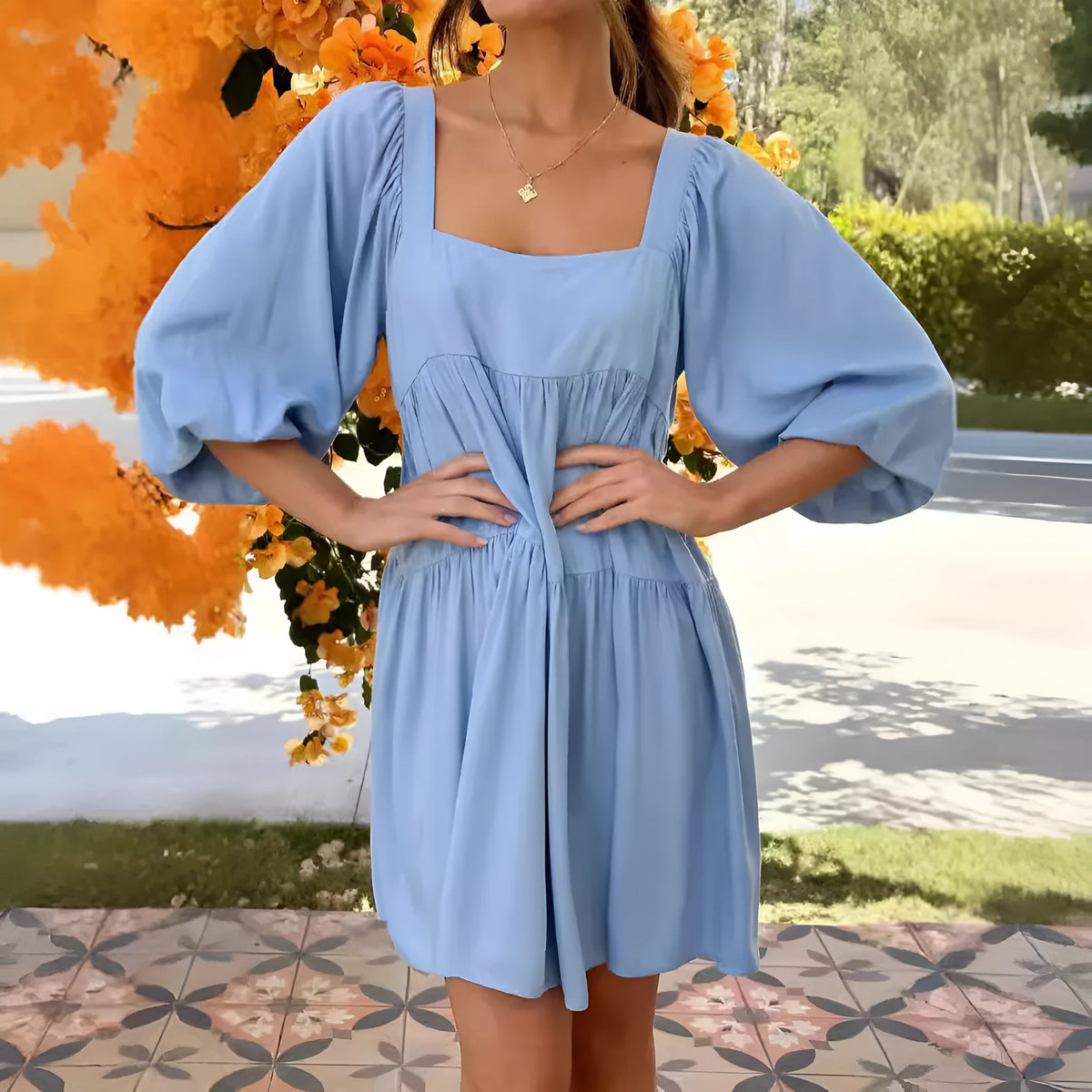 Orange red children's dress with square collar, puff sleeves, backless detail, and A-line skirt.