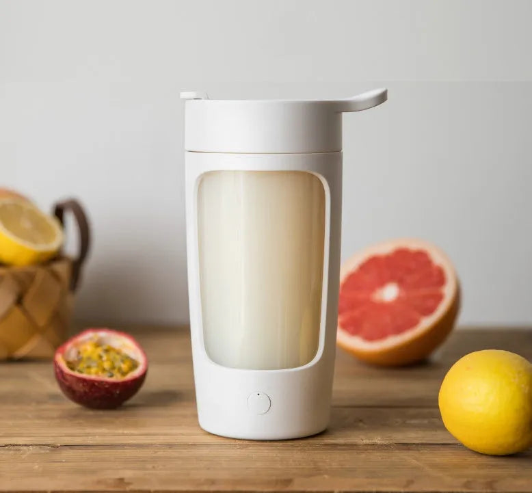 Portable USB rechargeable juice blender in black, blue, pink, or white with 650ml cup and compact design.