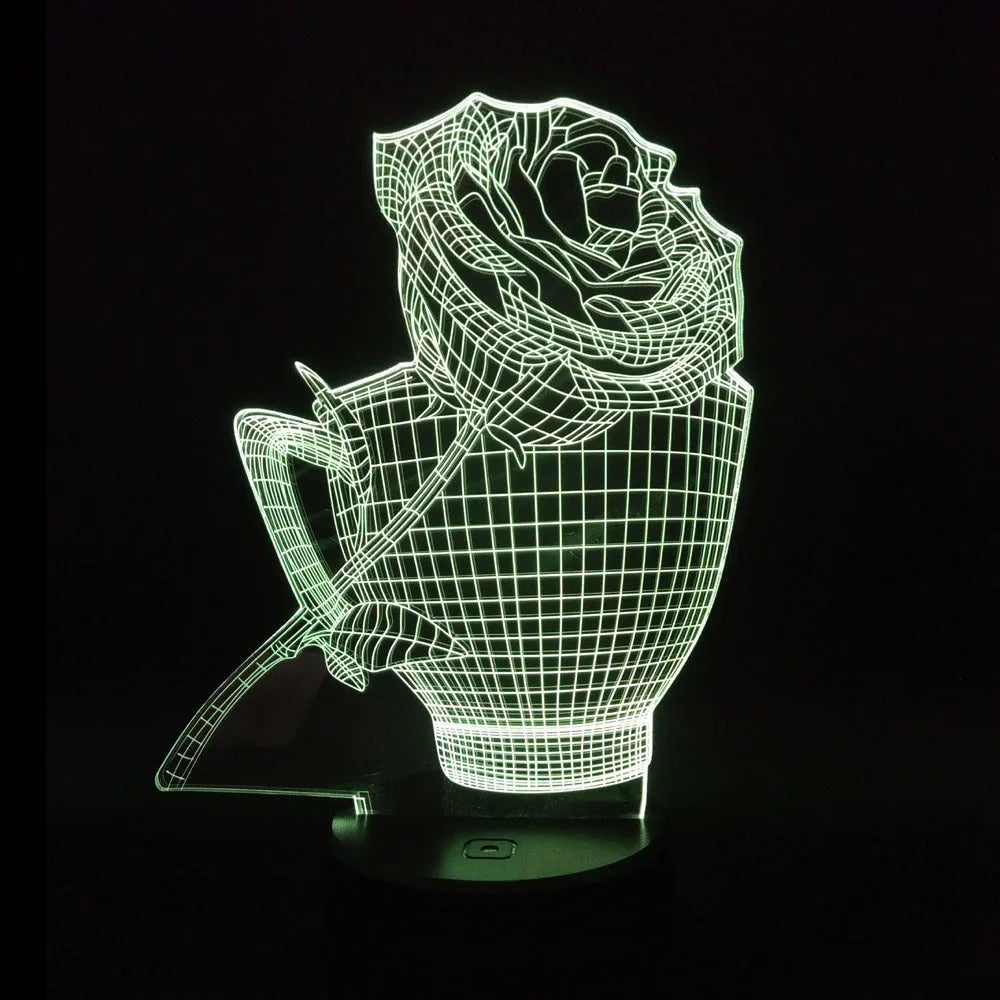 3D rose flower shaped night light with glowing LED colours on a black base, showing remote control.