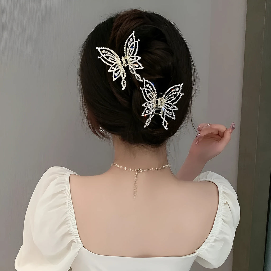 Alloy butterfly hair barrette clip with electroplated finish, shown in rhinestone and pearl style options