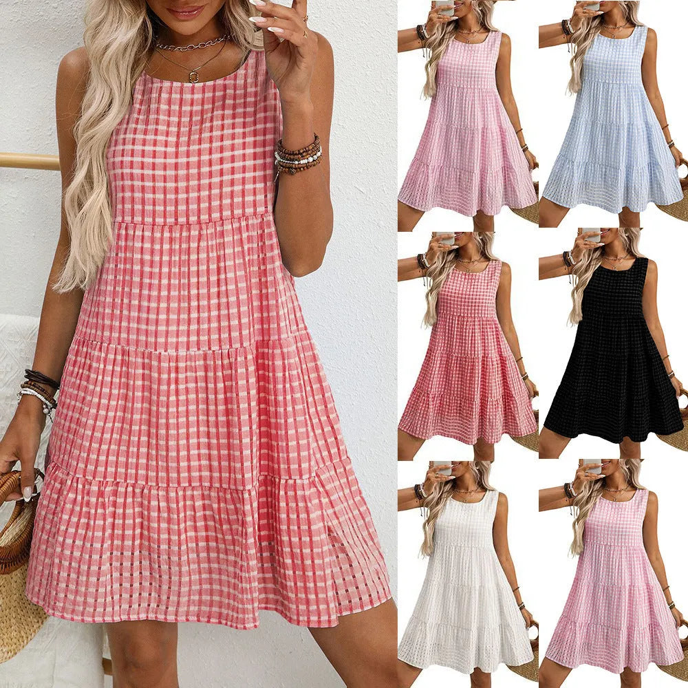 Women's light blue sleeveless plaid dress with high waist and swing skirt on a model.