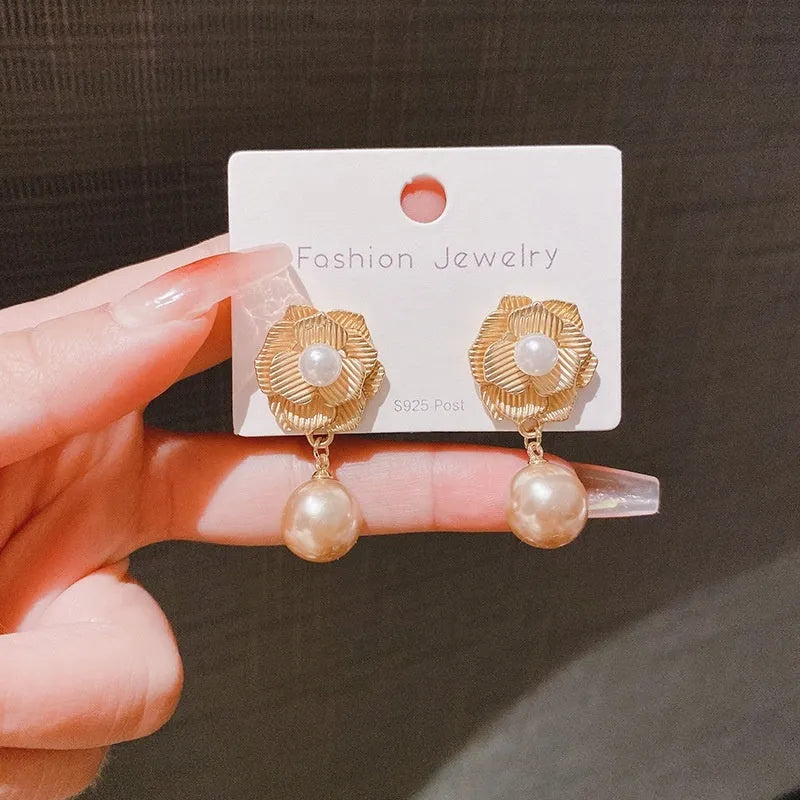 Gold electroplated Hong Kong style stud earrings with needle rose pearl and opal stone design.