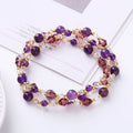 Women's adjustable crystal bracelet with three gemstone rings on rope band