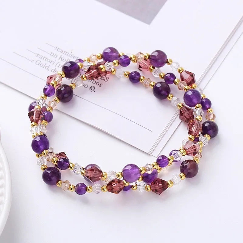 Women's adjustable crystal bracelet with three gemstone rings on rope band