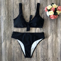 Women's solid colour polyester bikini swimsuit set in black, pink, red, white, or wine red.