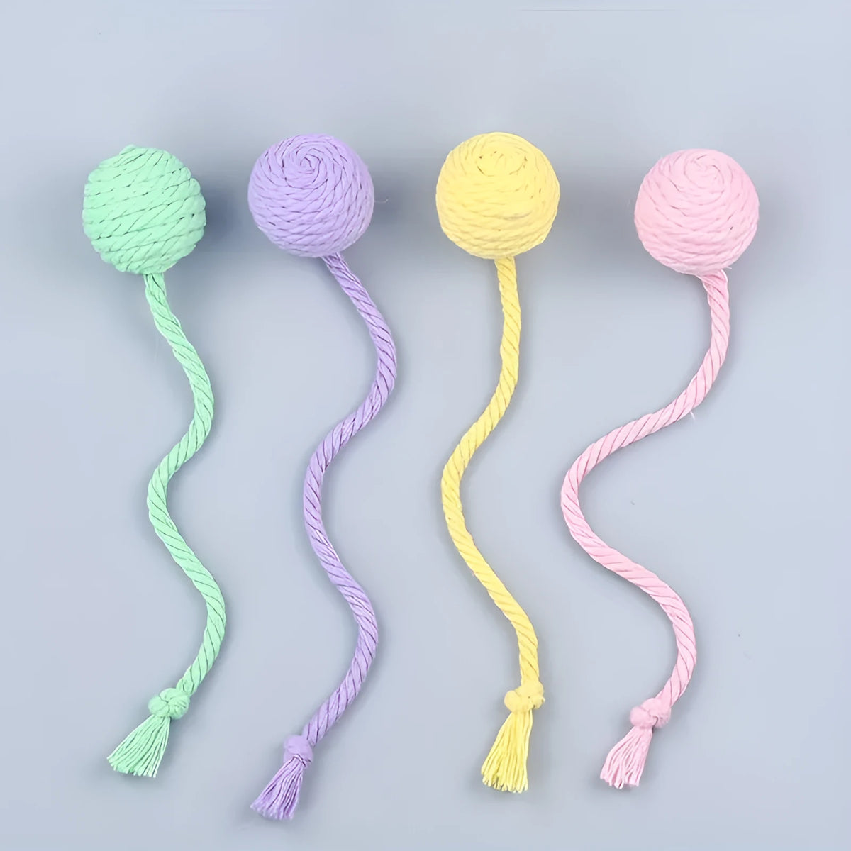 Colourful cat toy ball with rope and internal bell in small and medium sizes.