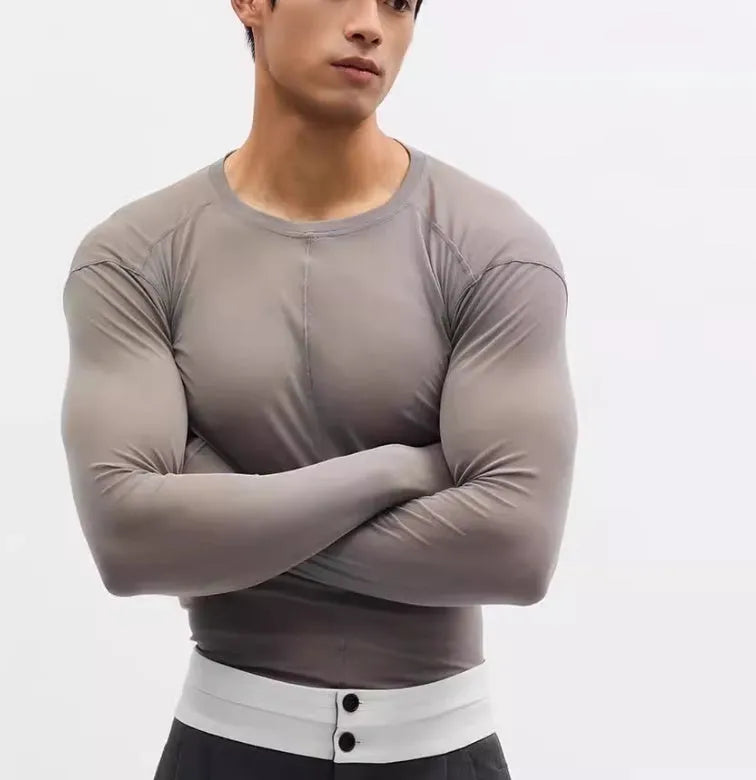 Black slim-fit mesh see-through long sleeve pullover on a model, showing texture.