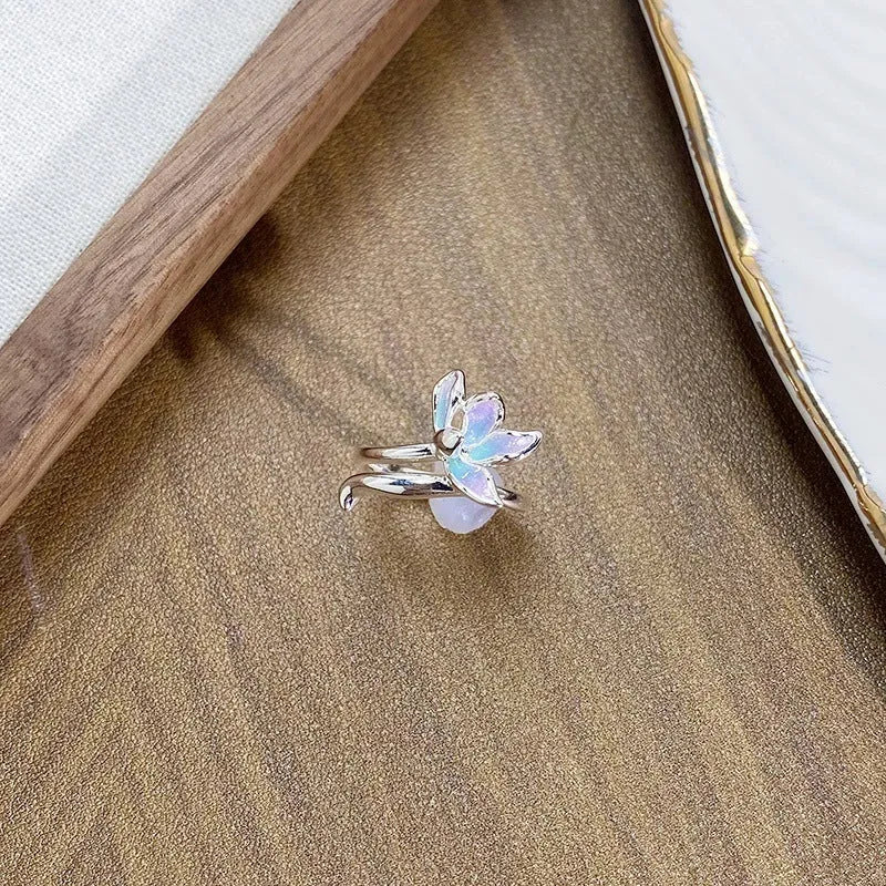 Adjustable copper insect ring with dripped oil finish in an irregular, artisanal design.