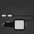 Black and gold dual USB car charger with retractable cable shown plugged into car dashboard