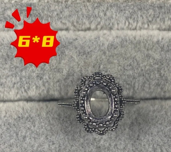 Oval denier ring with 6x8mm stone and five-pointed star element on copper band