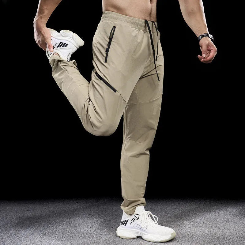 Men's waterproof quick-drying exercise trousers in nylon fabric for sports and fitness