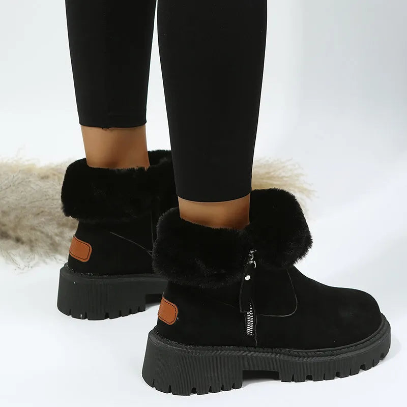Women's black faux suede high-top snow boots with side zip and non-slip rubber sole.