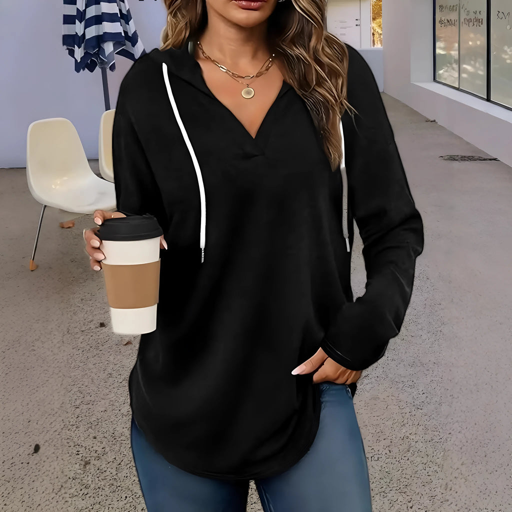 Red women's V-neck hooded sweatshirt with long sleeves on a hanger