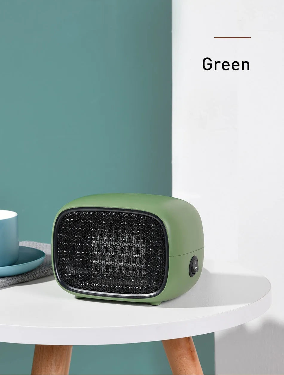 Mini portable electric heater in green colour with compact rectangular design for desk or bedside use