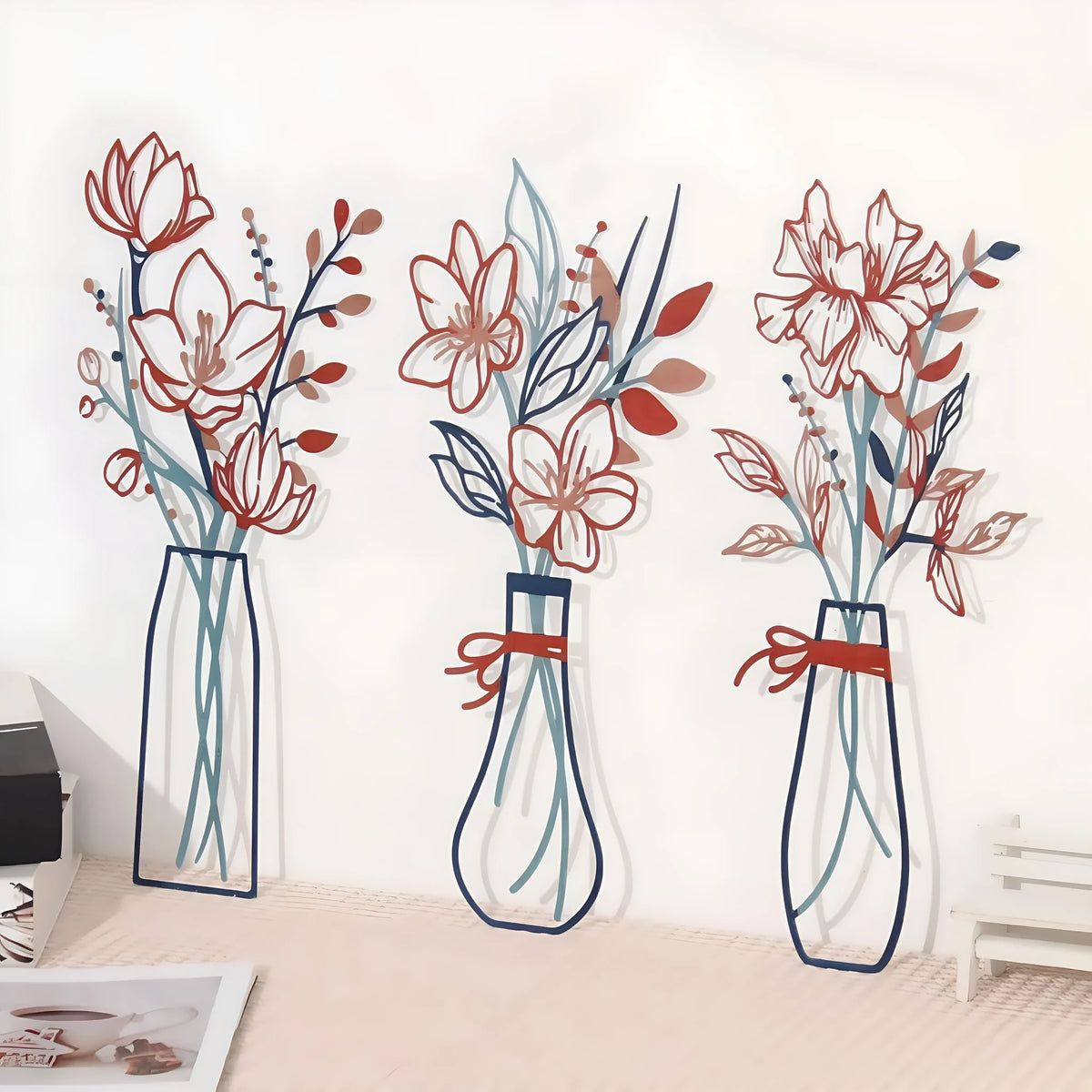 Set of three metal flower wall art pieces in a country farmhouse style for bathroom decoration.