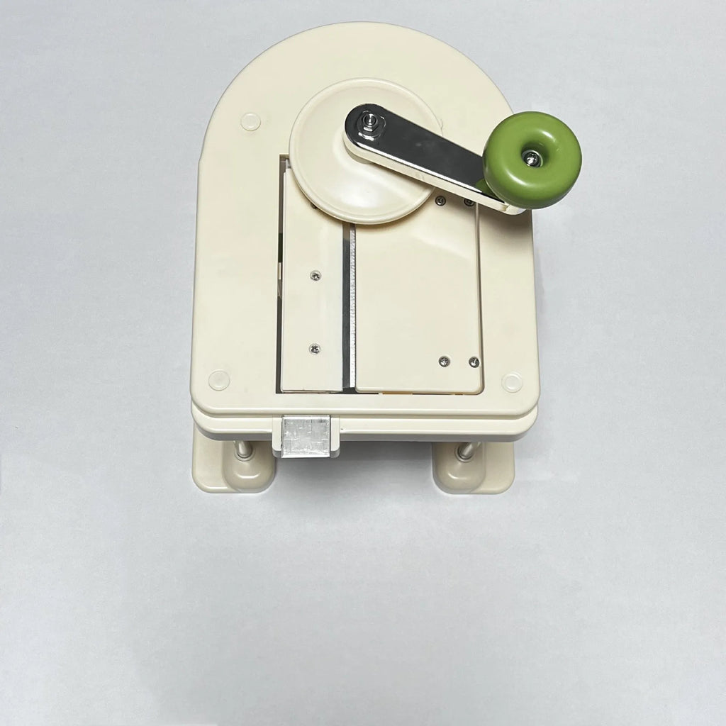 Beige kitchen vegetable slicer chopper tool with stainless steel blades for slicing potatoes and other vegetables