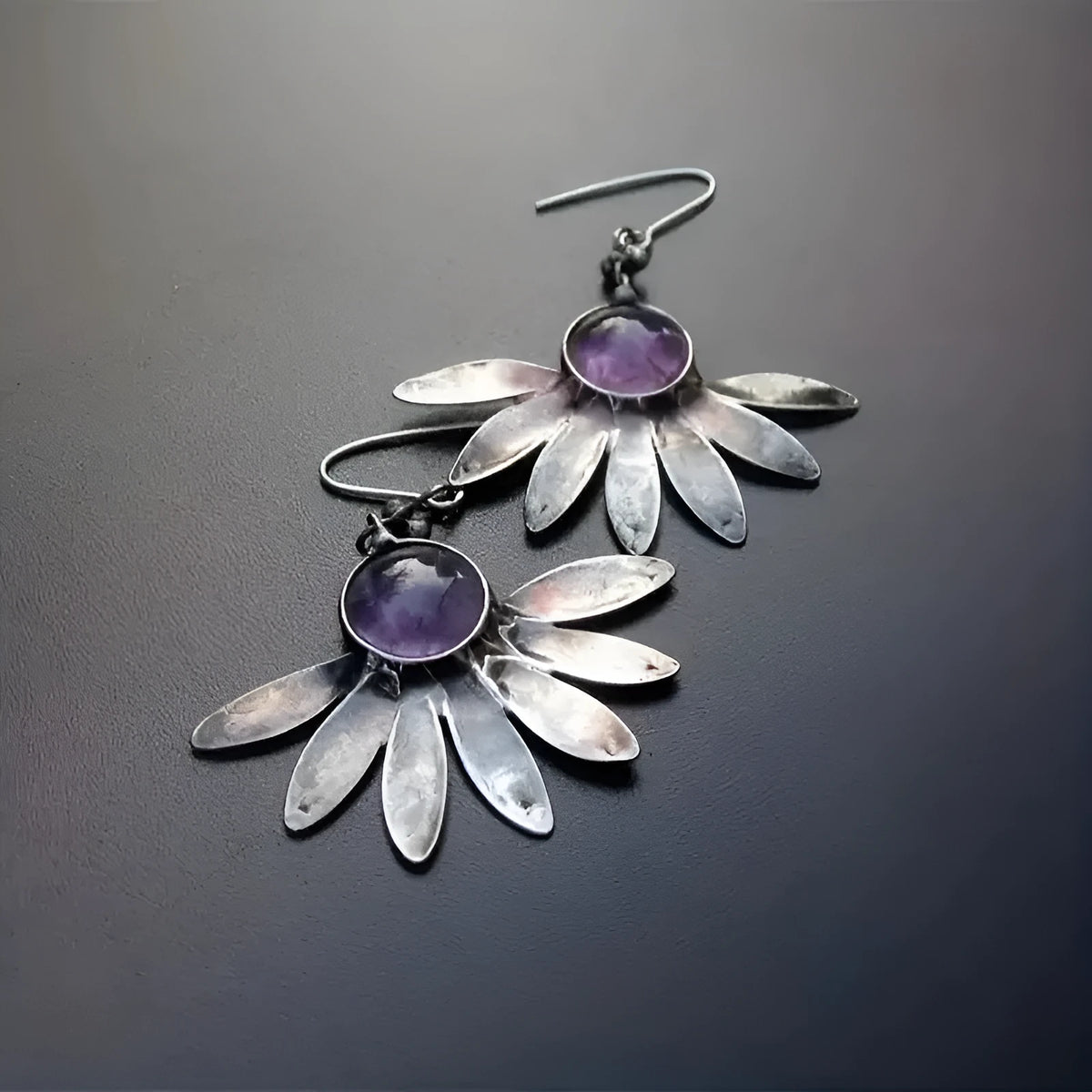 Purple bohemian-style earrings with animal and Zodiac modelling in resin and alloy.