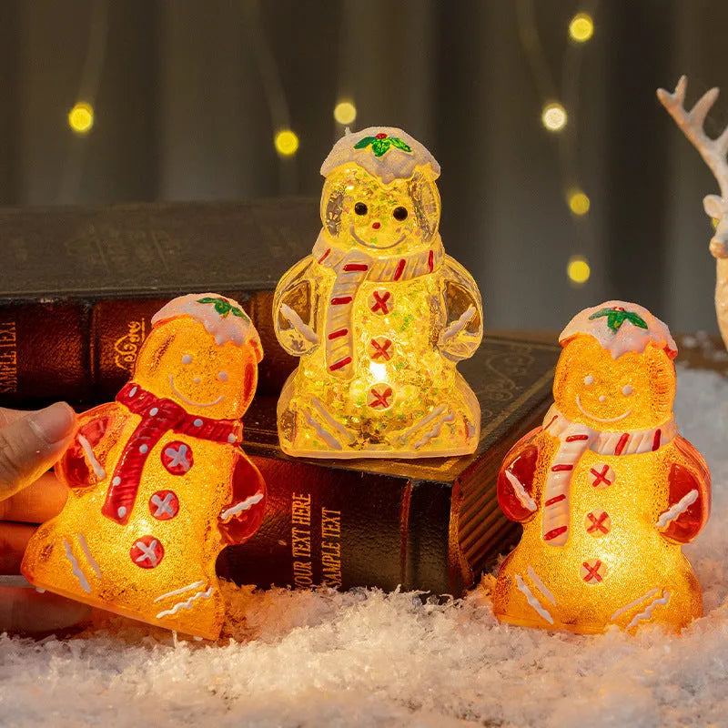 Glowing plastic gingerbread man and snowman Christmas tree ornament with coloured scarf
