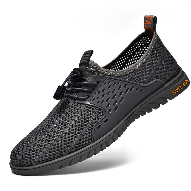 Men's black mesh casual slip-on shoe with elastic band and rubber sole on a white background.