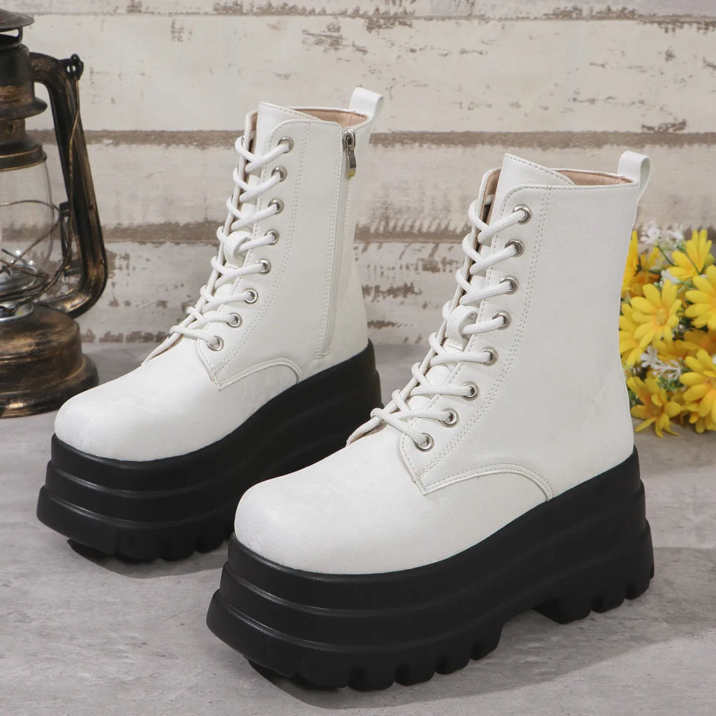 Women's black platform Martin boots with patchwork design, chunky heel, and side zipper.