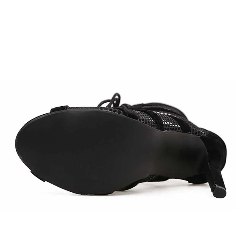 Black suede women's lace-up high heel shoes with a high stiletto heel and a front platform.