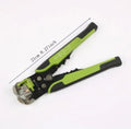 Yellow automatic 3-in-1 wire stripper and crimping pliers tool on a workbench