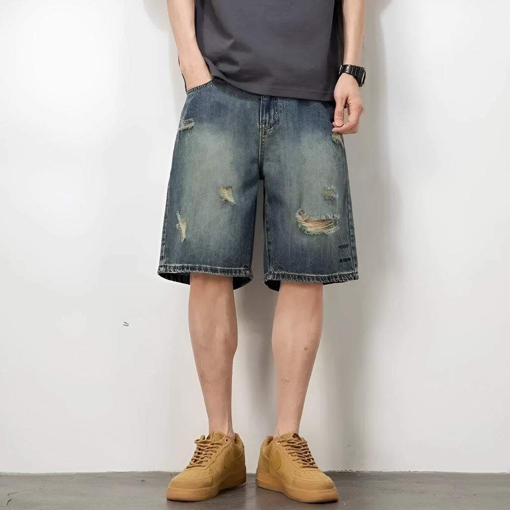 Blue retro denim shorts for men with loose hole design and straight leg cut