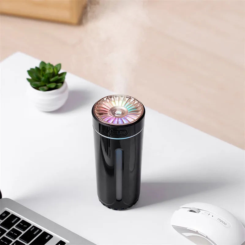 Black wireless USB humidifier with colourful lights on a car dashboard cup holder