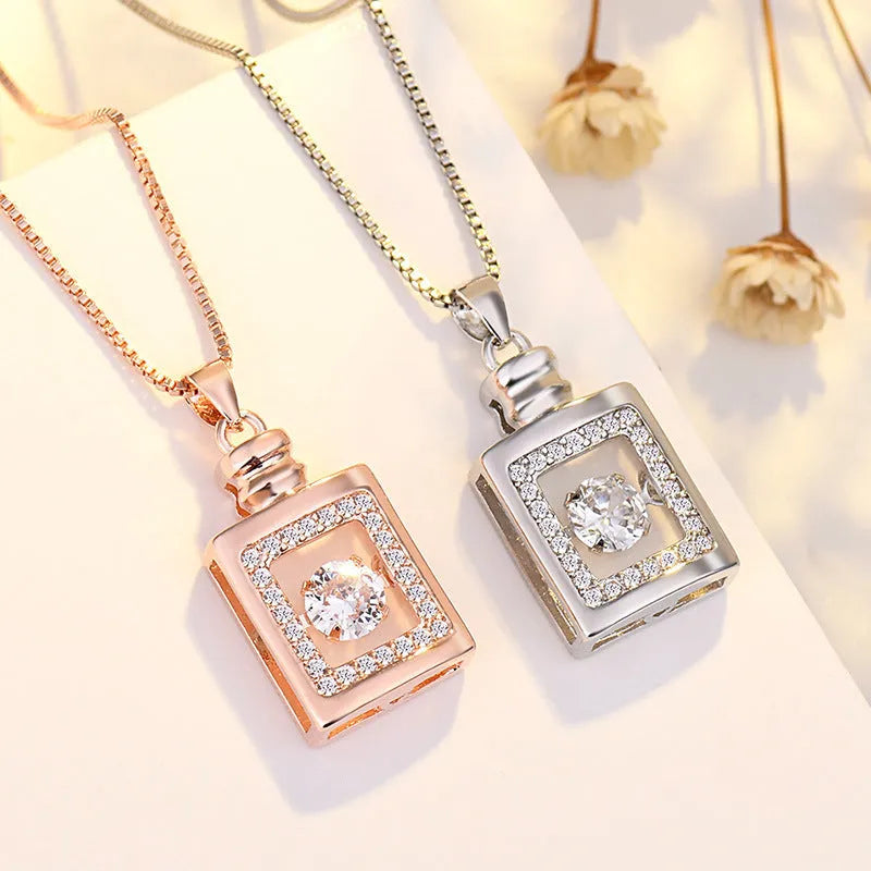 Silver love heart necklace with crown and bow details on clavicle-length chain