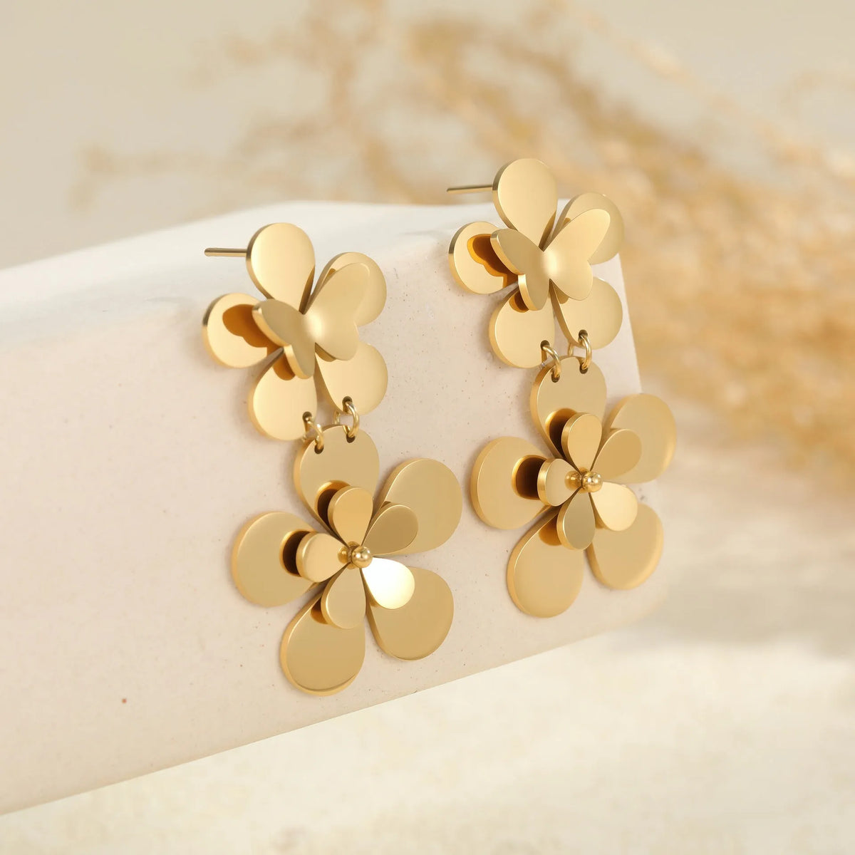 Gold electroplated stainless steel women's earrings with floral butterfly design