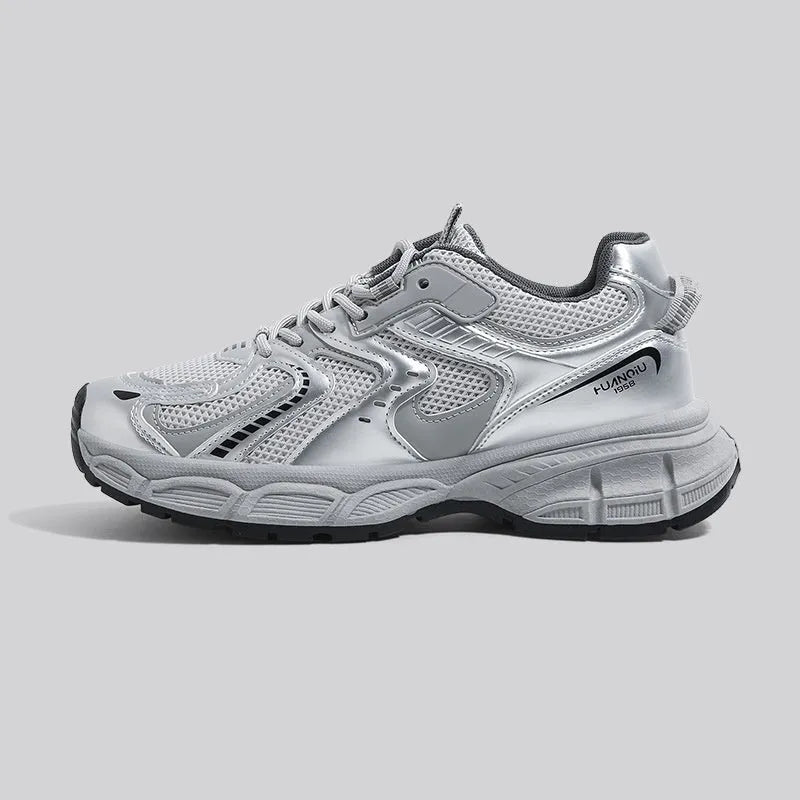 Grey low-top casual dad sneakers with a mid heel, PU mesh upper, and leather stitching on a white background.