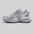 Grey low-top casual dad sneakers with a mid heel, PU mesh upper, and leather stitching on a white background.
