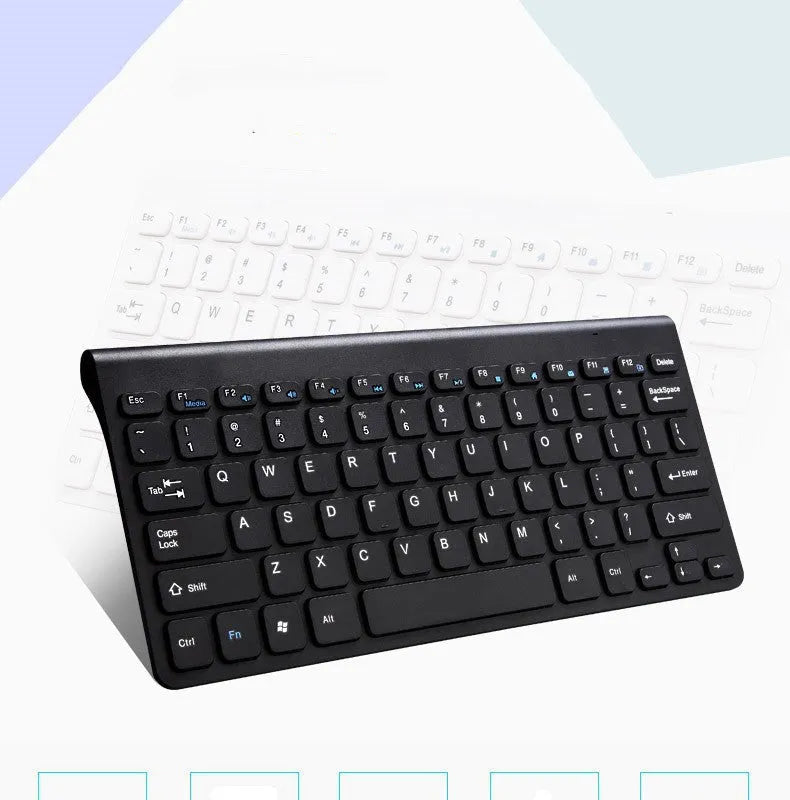 Black and white wireless keyboard and mouse set with USB receiver on desk