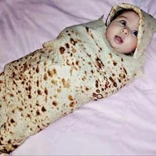 Round coral fleece burrito blanket with a food-themed print, shown folded.